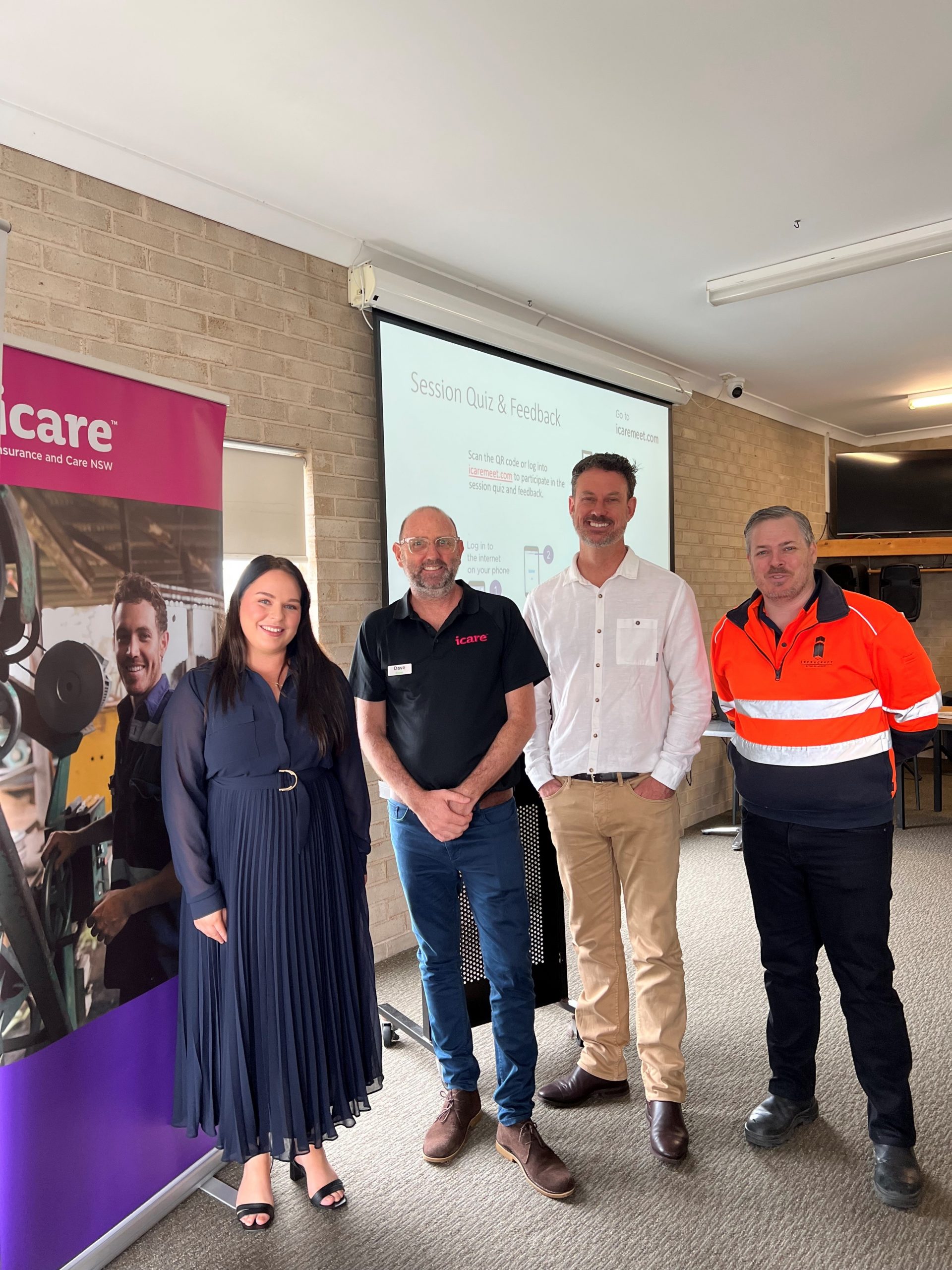 Our speakers for the CCSN - David Huxley and Adelaide Joseph (icare NSW), Jim Kelly (SafeWork NSW) and Chris Lawrence (Infracraft). They stand in a group for a photo together at the front of the event. October 22 Breakfast -